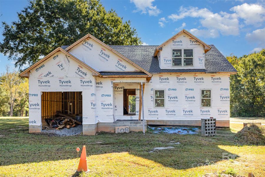 Front exterior of a new home in , Wesley Chapel, NC, highlighting curb appeal (Image 1).