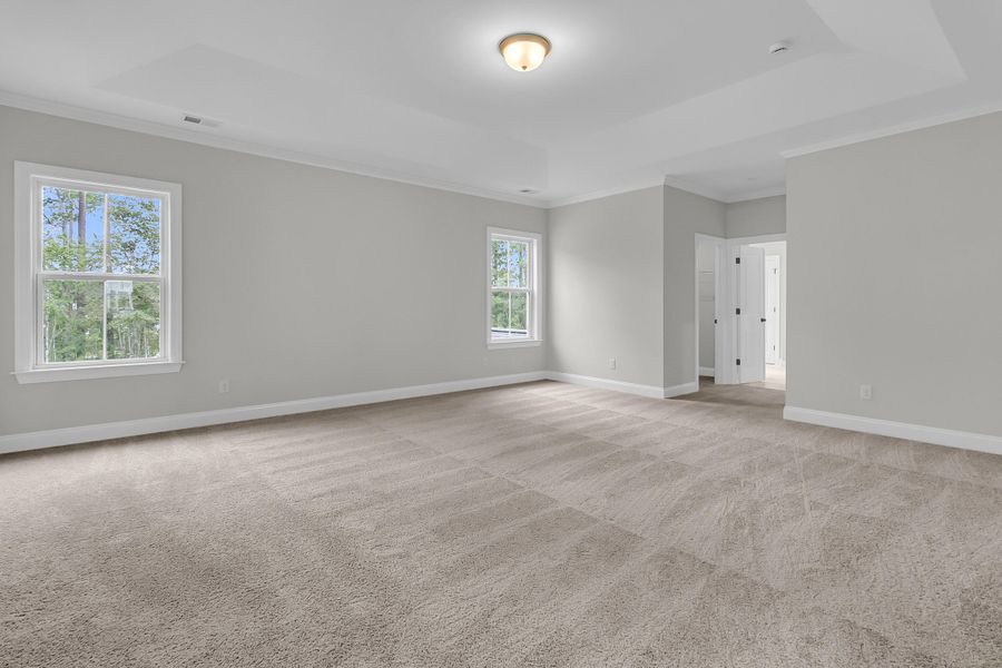 Spacious, unfurnished interior of a new home in Tidewater at Lakes of Cane Bay, Summerville (Image 20).
