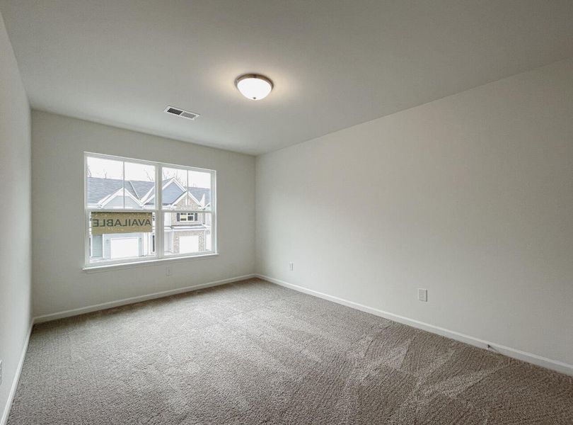 Spacious, unfurnished interior of a new home in East Main Townes, Spartanburg (Image 19).