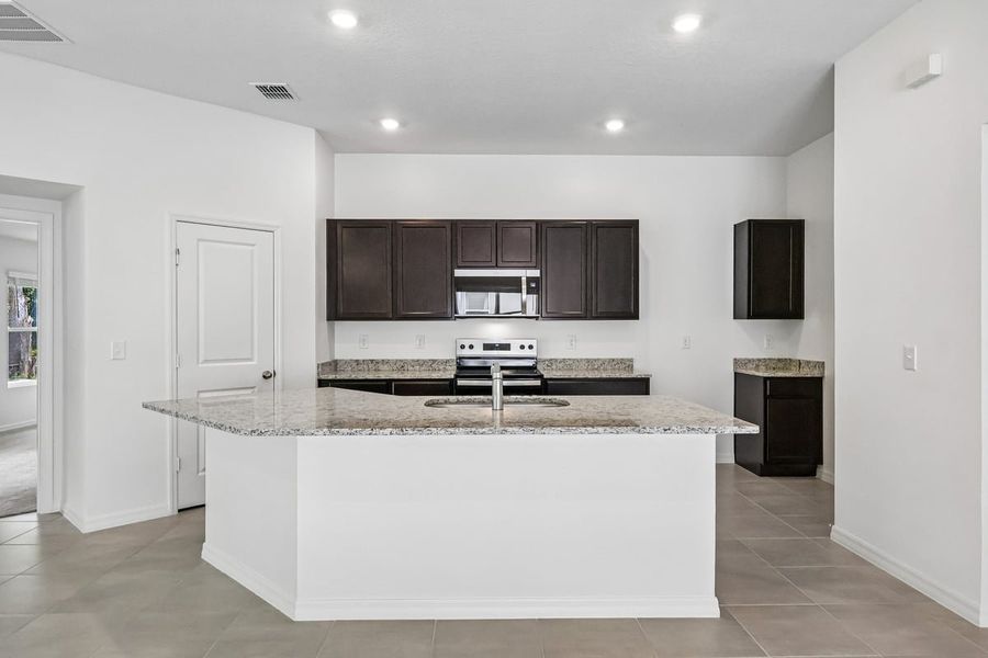 Furnished interior view inside a new home in Hilliard Ridge, Kissimmee (Image 6).