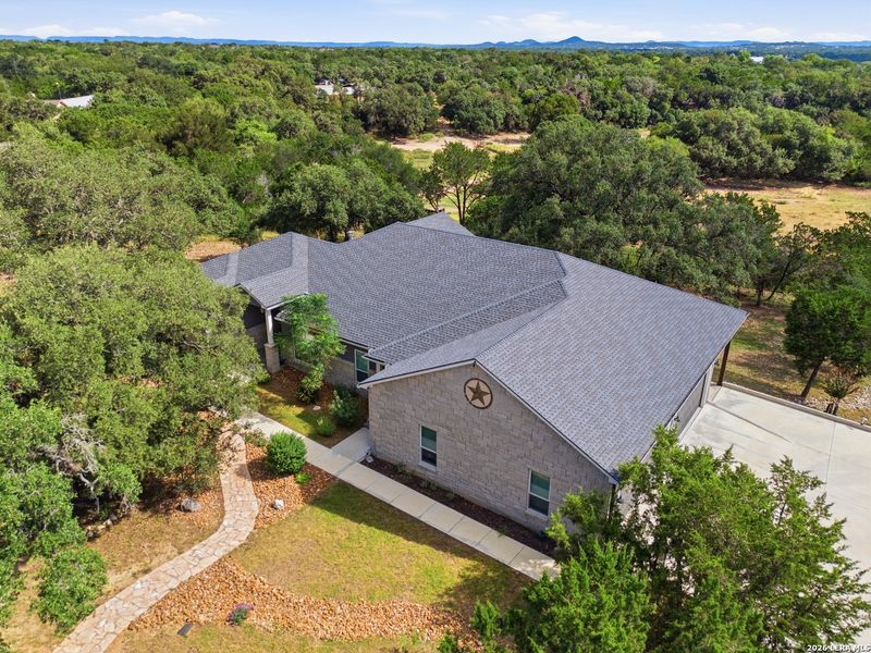 Front exterior of a new home in , Bandera, TX, highlighting curb appeal (Image 1). Front exterior of a new home in , Bandera, TX, highlighting curb appeal (Image 1).