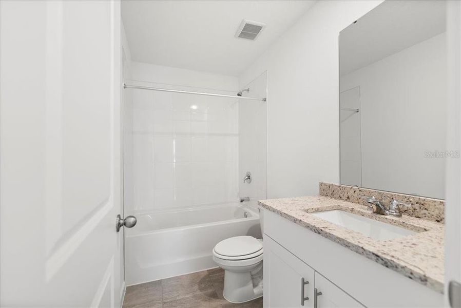 Furnished interior view inside a new home in Flagler Village - Classic Series, Palm Coast (Image 6). Furnished interior view inside a new home in Flagler Village - Classic Series, Palm Coast (Image 6).