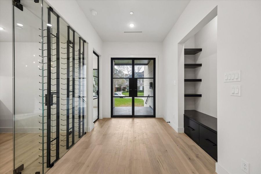 (PLAN layout of the home is attached) Wide plank Reward Sereno Brazza wood flooring carries on throughout both the first and second stories. Glass panels are framed in stair railings which match the flooring. Custom-made Anderson insulated low-e casement, fixed and sliding doors throughout the house.