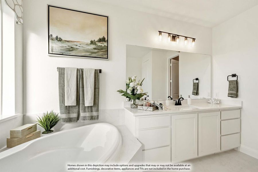 Master bathroom with white double vanity, soaking tub, large mirror, and black light fixtures
