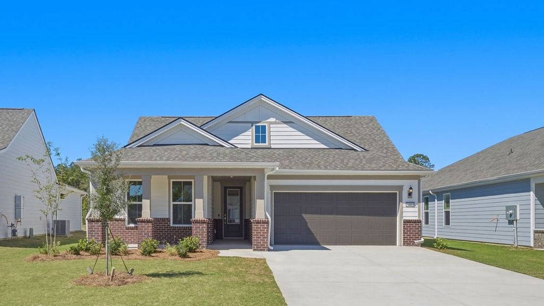 Front exterior of a new home in Sun City Hilton Head, Bluffton, SC, highlighting curb appeal (Image 2). Front exterior of a new home in Sun City Hilton Head, Bluffton, SC, highlighting curb appeal (Image 2).