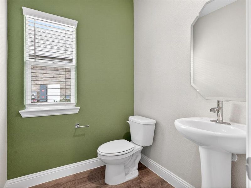 Pedestal sink with chrome faucet and white toilet Pedestal sink with chrome faucet and white toilet