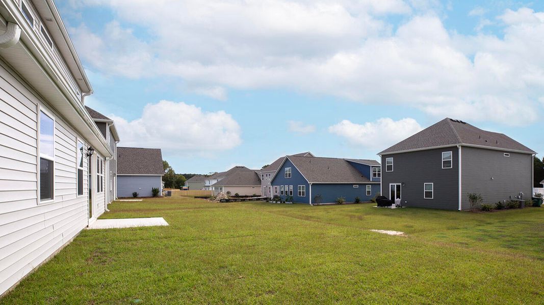 Exterior details and patio area of a home in Surfside Landing, Hubert (Image 2). Exterior details and patio area of a home in Surfside Landing, Hubert (Image 2).