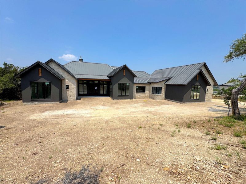Front exterior of a new home in , Canyon Lake, TX, highlighting curb appeal (Image 14). Front exterior of a new home in , Canyon Lake, TX, highlighting curb appeal (Image 14).