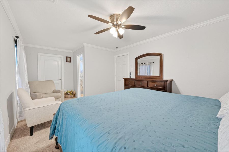 Alternate view of the second-level bedroom showcasing bright interior.