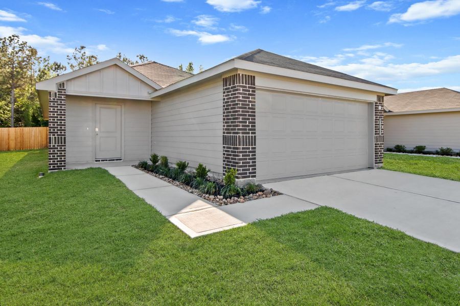Front exterior of a new home in Porters Mill, New Caney, TX, highlighting curb appeal (Image 2). Front exterior of a new home in Porters Mill, New Caney, TX, highlighting curb appeal (Image 2).