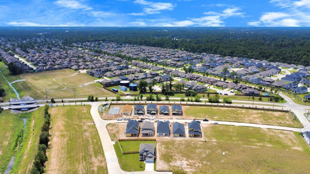 An aerial view of a spacious subdivision lot, highlighting a well-maintained yard and a fully fenced perimeter, offering both privacy and expansive outdoor space. An aerial view of a spacious subdivision lot, highlighting a well-maintained yard and a fully fenced perimeter, offering both privacy and expansive outdoor space.