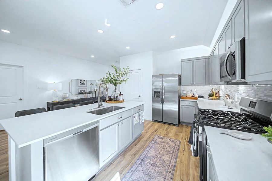 Furnished interior view inside a new home in Pinewood at Grand Texas, New Caney (Image 9).