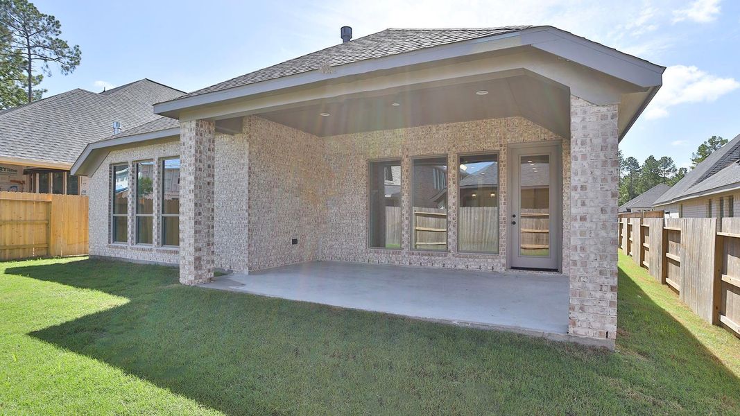 Exterior details and patio area of a home in Woodhavyn, Magnolia (Image 3). Exterior details and patio area of a home in Woodhavyn, Magnolia (Image 3).