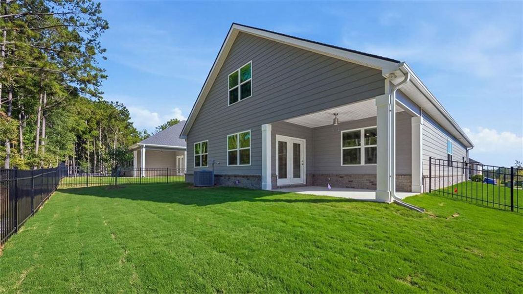 Exterior details and patio area of a home in Oak Ridge Meadows - Active Adult, Locust Grove (Image 2).