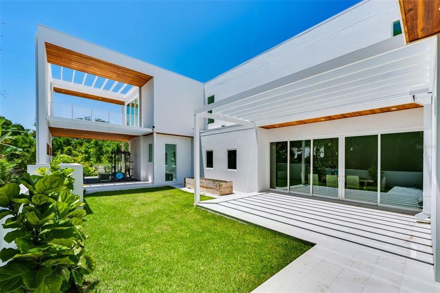 Exterior details and patio area of a home in , Sarasota (Image 50).
