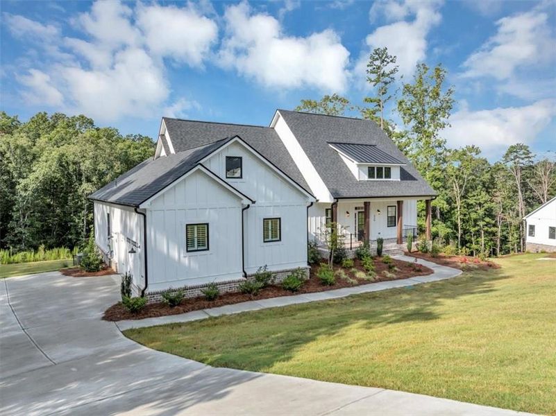 Front exterior of a new home in , Ball Ground, GA, highlighting curb appeal (Image 26).