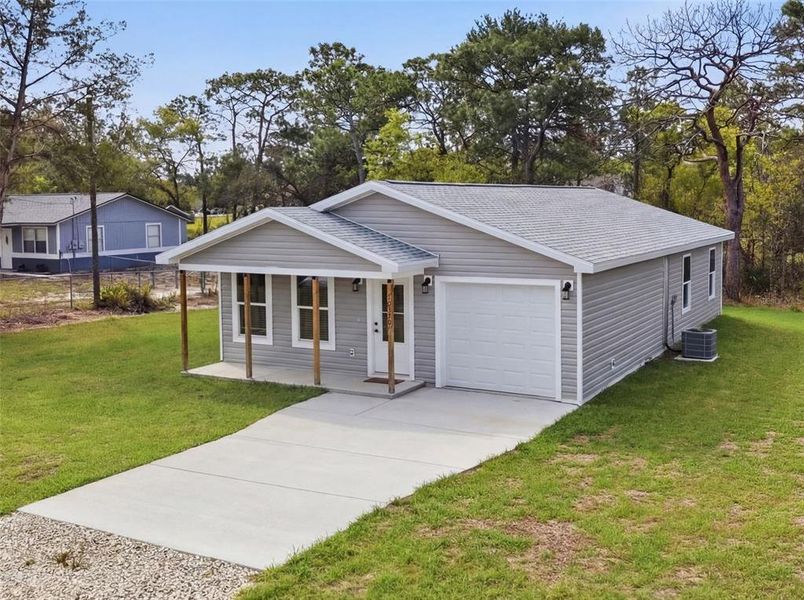 Front exterior of a new home in , Weeki Wachee, FL, highlighting curb appeal (Image 28).