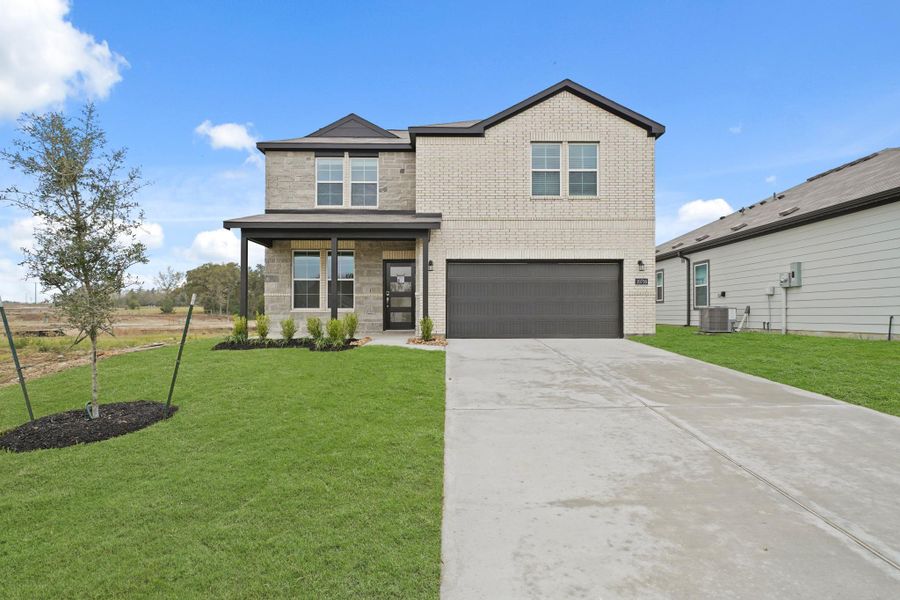 Front exterior of a new home in Reveille Estates, Bryan, TX, highlighting curb appeal (Image 1). Front exterior of a new home in Reveille Estates, Bryan, TX, highlighting curb appeal (Image 1).