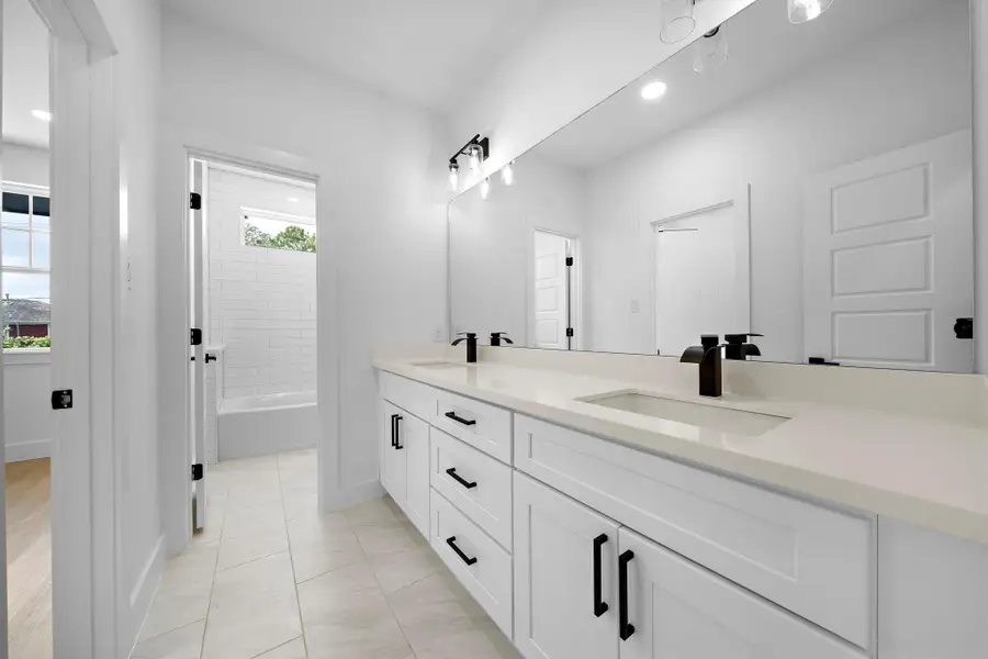 Secondary full bathroom with duel vanity. Secondary full bathroom with duel vanity.