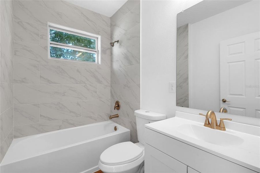 Second bath with tile * tub and shower * window for nice lighting