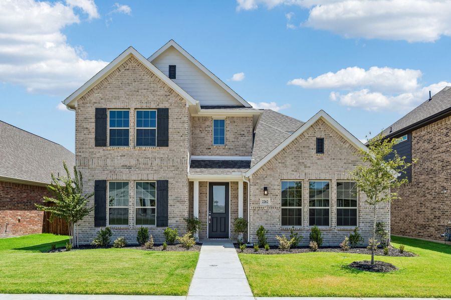 Front exterior of a new home in Dove Hollow, Waxahachie, TX, highlighting curb appeal (Image 22). Front exterior of a new home in Dove Hollow, Waxahachie, TX, highlighting curb appeal (Image 22).