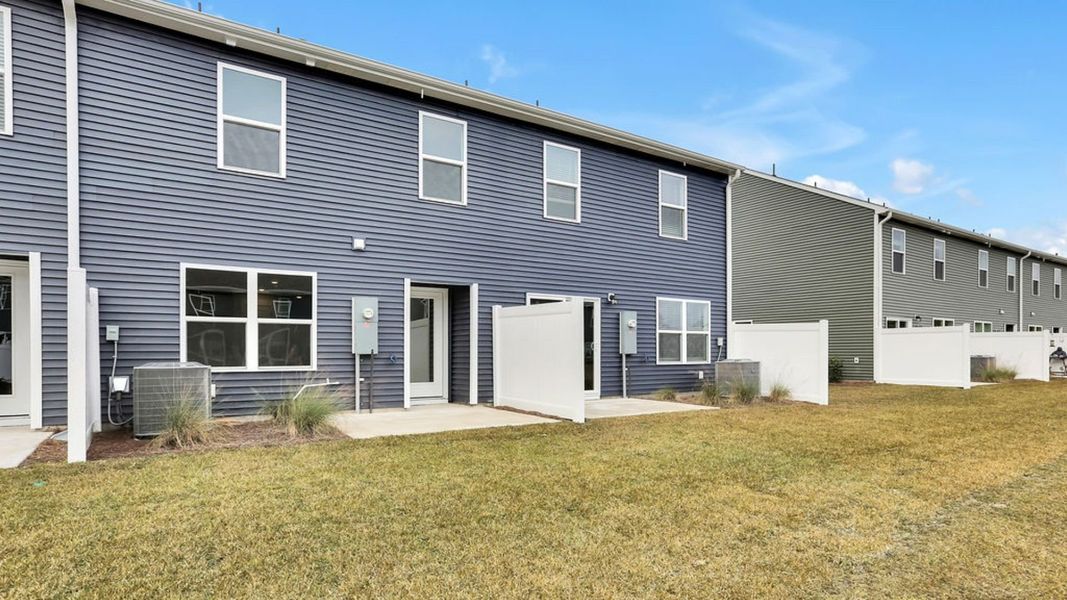Exterior details and patio area of a home in Grayson Park Townhomes, Leland (Image 3). Exterior details and patio area of a home in Grayson Park Townhomes, Leland (Image 3).