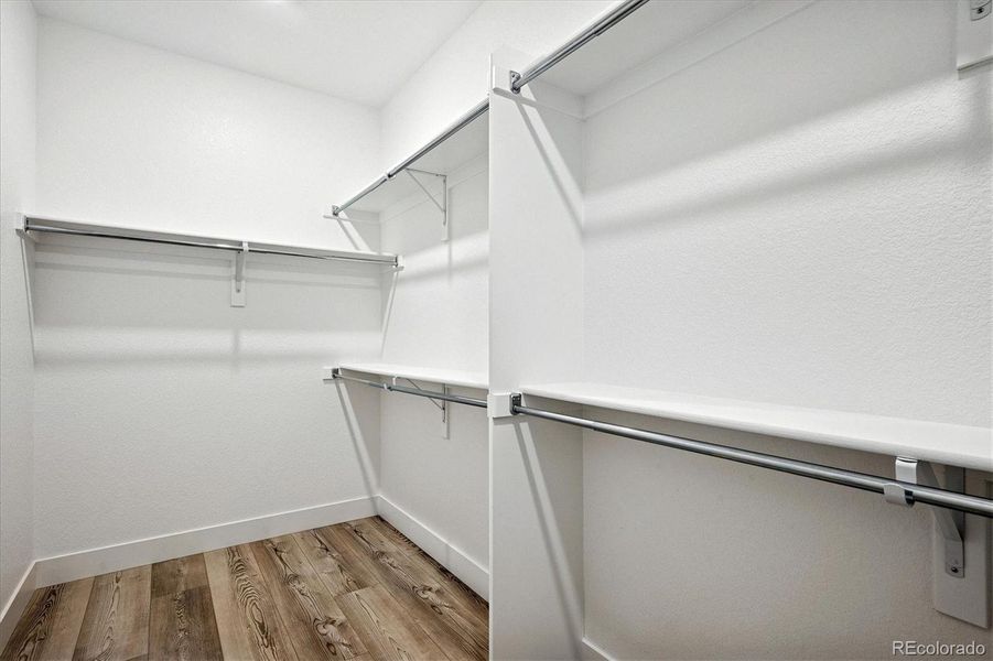 Primary walk-in closet Primary walk-in closet