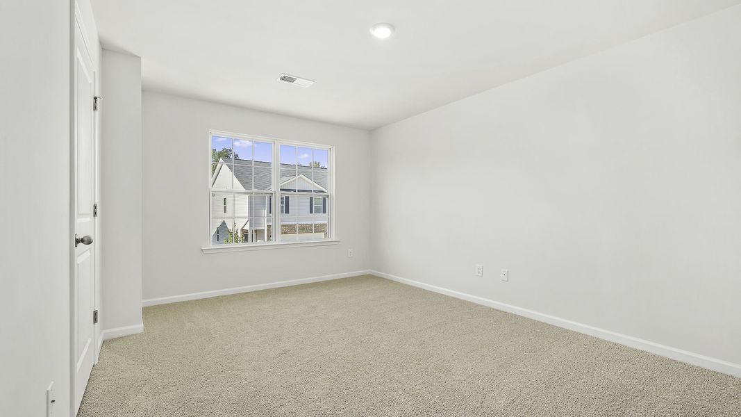 Spacious, unfurnished interior of a new home in North Village Townes, Greensboro (Image 10).