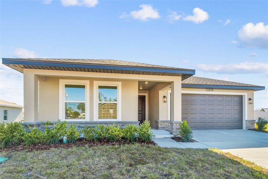 Front exterior of a new home in , Spring Hill, FL, highlighting curb appeal (Image 33).