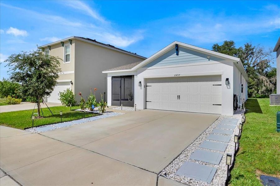 Front exterior of a new home in , Davenport, FL, highlighting curb appeal (Image 19).