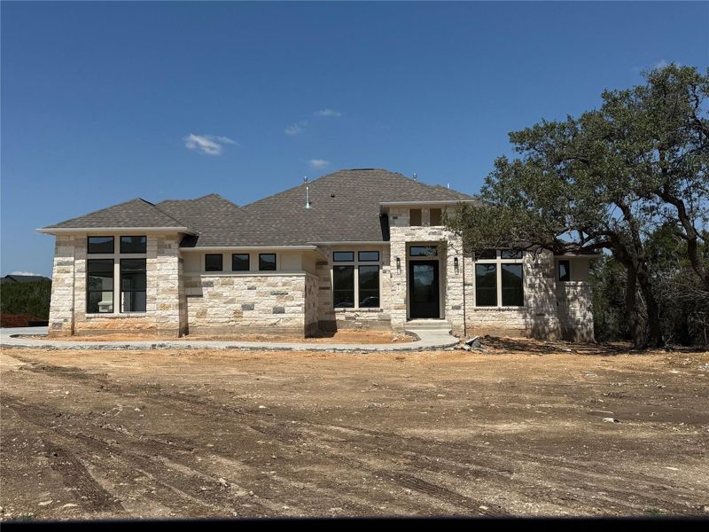 Front exterior of a new home in ClearWater Ranch, Liberty Hill, TX, highlighting curb appeal (Image 2). Front exterior of a new home in ClearWater Ranch, Liberty Hill, TX, highlighting curb appeal (Image 2).