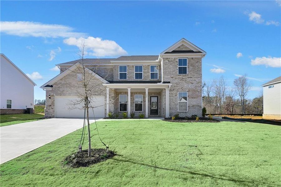 Front exterior of a new home in Anderson Point Estates, McDonough, GA, highlighting curb appeal (Image 17).