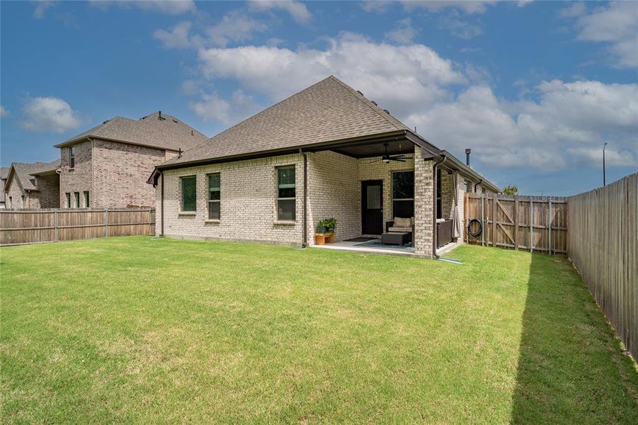 Rear of home and backyard