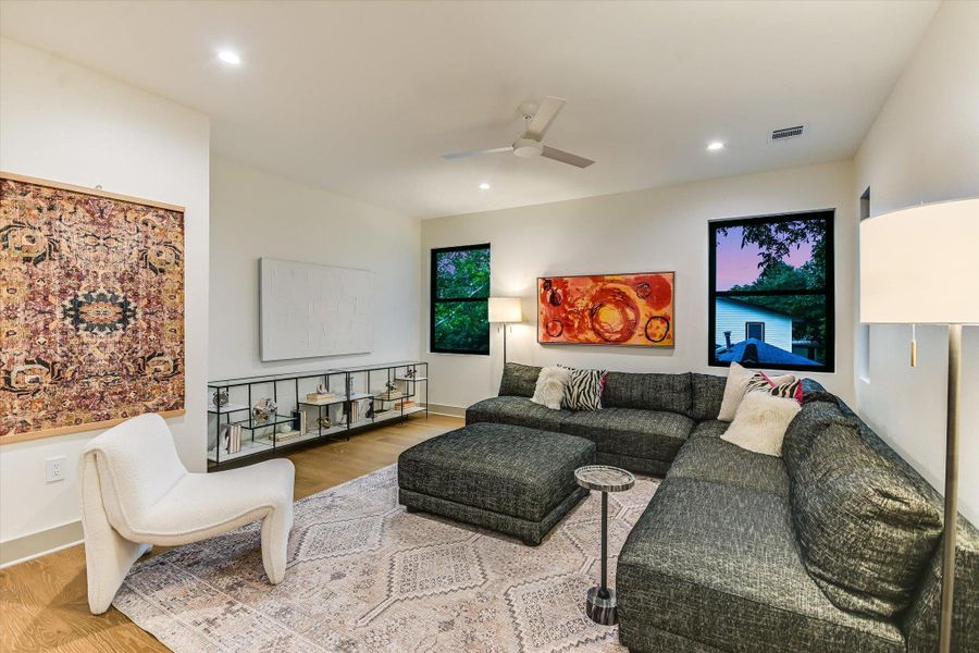 A chic loft/game room with recessed lighting, warm wood flooring, and a desk alcove. Plenty of space to spread out! A chic loft/game room with recessed lighting, warm wood flooring, and a desk alcove. Plenty of space to spread out!