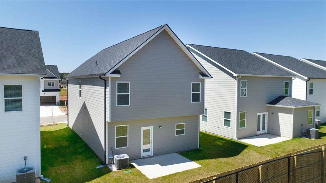 Front exterior of a new home in Shoal Creek, Hampton, GA, highlighting curb appeal (Image 21). Front exterior of a new home in Shoal Creek, Hampton, GA, highlighting curb appeal (Image 21).