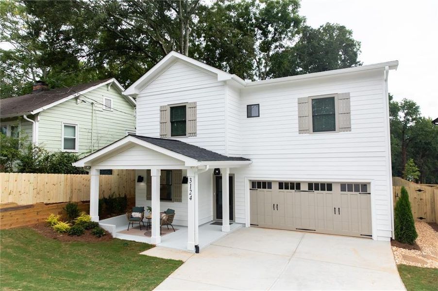 Front exterior of a new home in , Scottdale, GA, highlighting curb appeal (Image 1). Front exterior of a new home in , Scottdale, GA, highlighting curb appeal (Image 1).