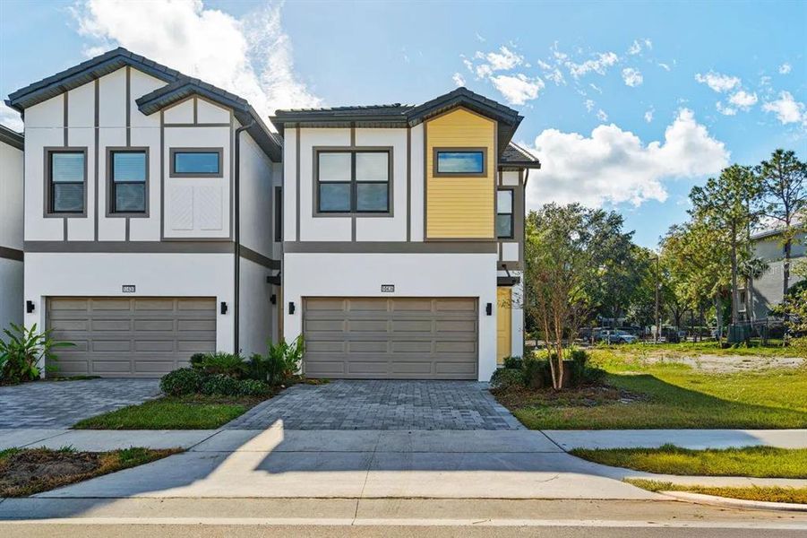 Front exterior of a new home in , Orlando, FL, highlighting curb appeal (Image 1). Front exterior of a new home in , Orlando, FL, highlighting curb appeal (Image 1).
