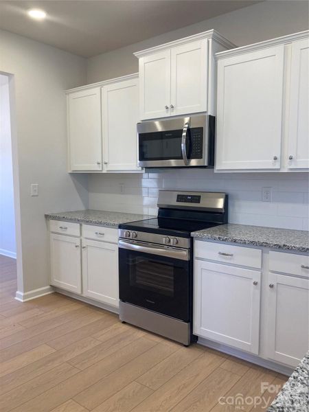 Furnished interior view inside a new home in Sunset Meadows, Charlotte (Image 6).