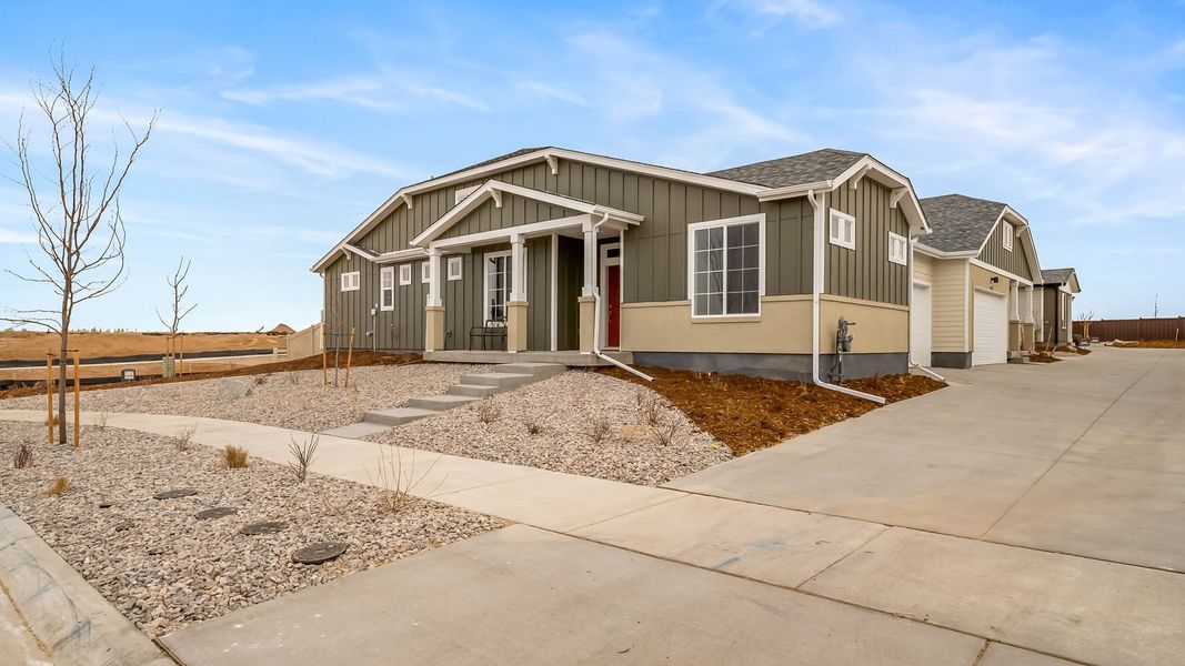 Front exterior of a new home in The Reserve at Green Valley Ranch Aurora, Aurora, CO, highlighting curb appeal (Image 1). Front exterior of a new home in The Reserve at Green Valley Ranch Aurora, Aurora, CO, highlighting curb appeal (Image 1).