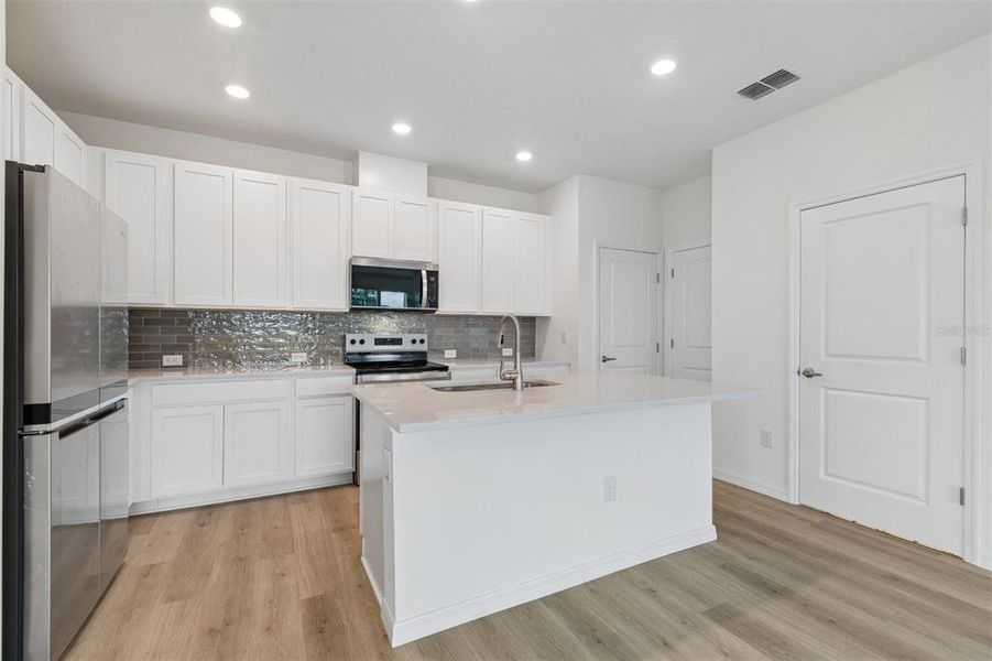 Furnished interior view inside a new home in Waterset Townhomes, Apollo Beach (Image 7).