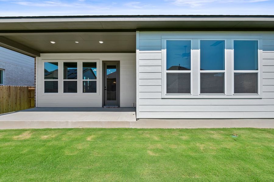 Exterior details and patio area of a home in Arbor Collection at Lariat, Liberty Hill (Image 24).