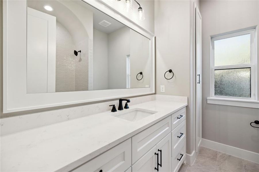 Bathroom with vanity and walk in shower