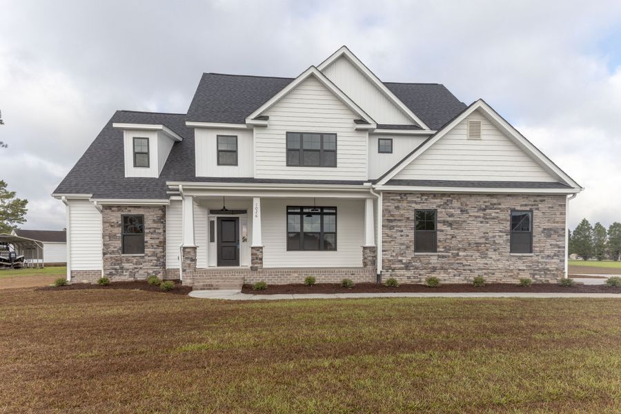 Representative exterior photo of a completed home built from the Carson by Bill Clark Homes in Cheshire Landing, Grimesland, NC (Image 33). Representative exterior photo of a completed home built from the Carson by Bill Clark Homes in Cheshire Landing, Grimesland, NC (Image 33).
