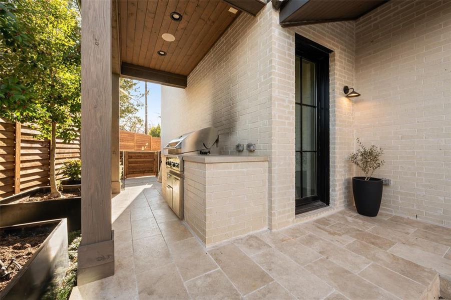 View of patio with an outdoor kitchen
