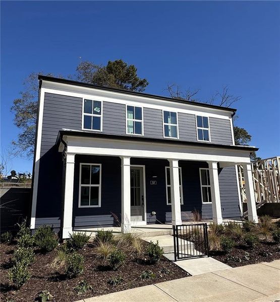 Front exterior of a new home in Harmony, Auburn, GA, highlighting curb appeal (Image 2).
