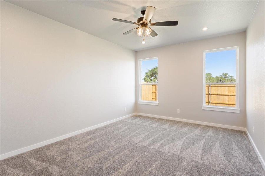 Unfurnished room with carpet flooring, a ceiling fan, and recessed lighting