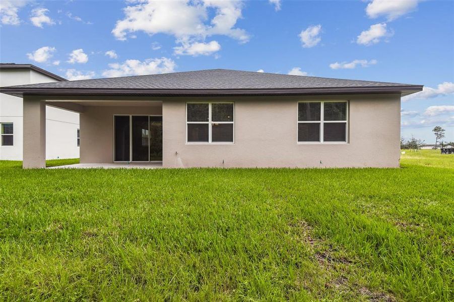 Front exterior of a new home in Hidden Ridge, New Port Richey, FL, highlighting curb appeal (Image 27).