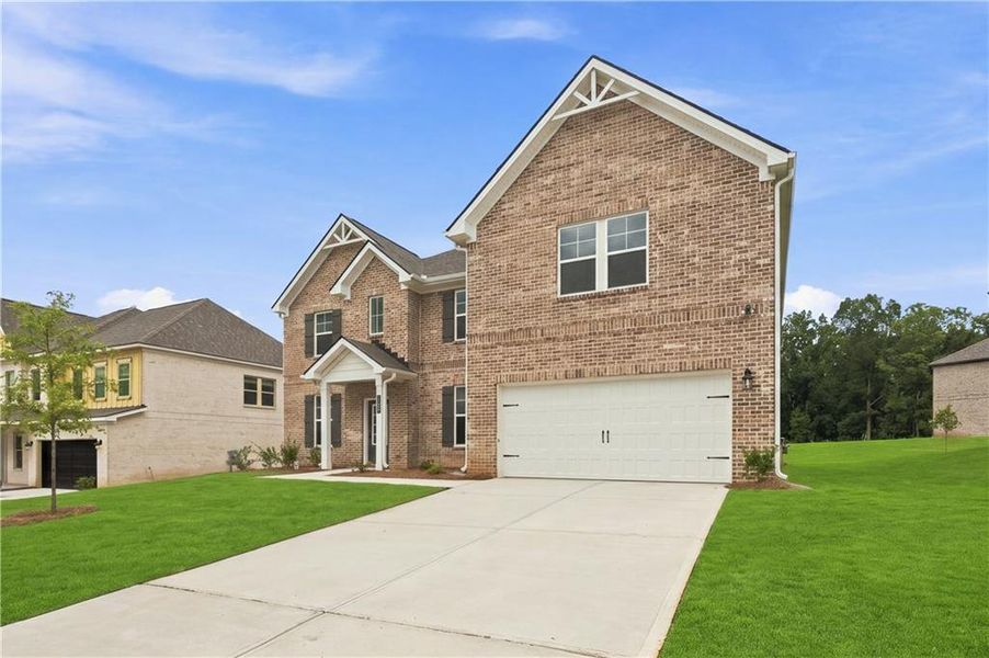 Front exterior of a new home in Westwind Estates, Hampton, GA, highlighting curb appeal (Image 2). Front exterior of a new home in Westwind Estates, Hampton, GA, highlighting curb appeal (Image 2).