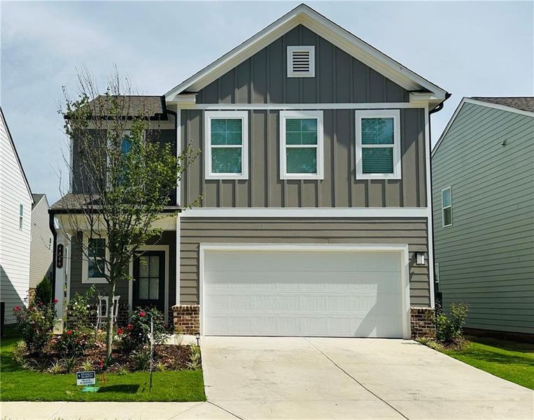 Front exterior of a new home in , Lilburn, GA, highlighting curb appeal (Image 21).