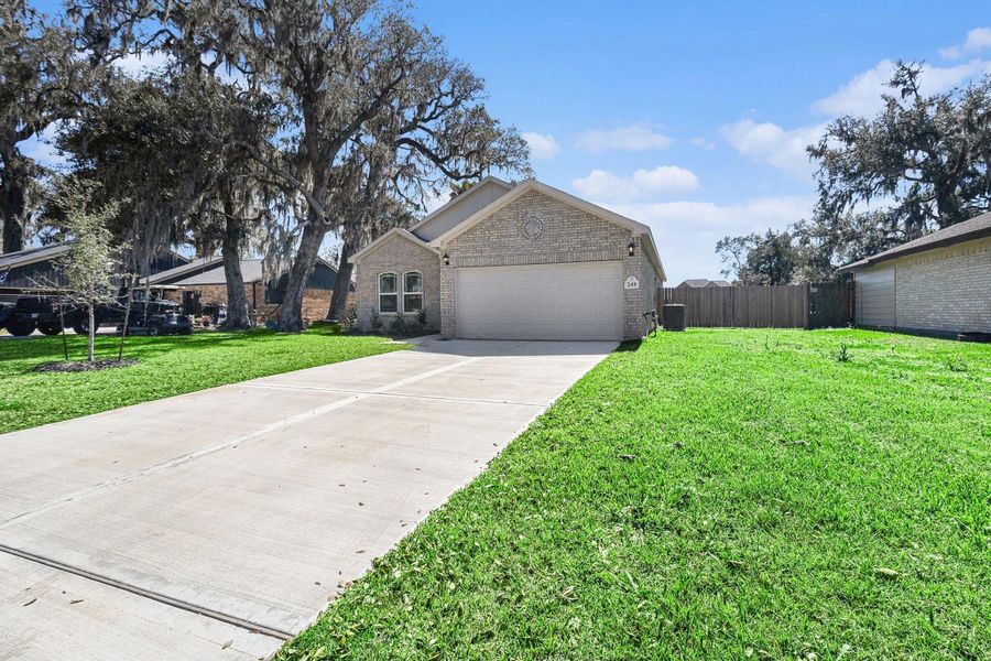 Front exterior of a new home in Columbia Lakes, West Columbia, TX, highlighting curb appeal (Image 2). Front exterior of a new home in Columbia Lakes, West Columbia, TX, highlighting curb appeal (Image 2).